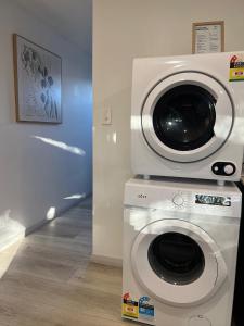 a washing machine sitting on top of a washer at Rustic PepperTree Views in Rockingham