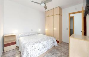 a bedroom with a bed and a ceiling fan at 2 Bedroom Lovely Apartment In Vinaroz in Vinaròs +17 photos