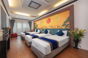 Ένα ή περισσότερα κρεβάτια σε δωμάτιο στο Eclipse Legend Hotel +135 φωτογραφίες