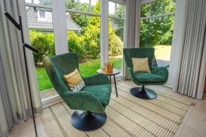 Χώρος καθιστικού στο Reethaus StrandZeit in Lobbe - Haushälfte 1