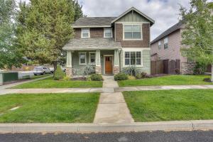 a house with a sidewalk in front of it at Aspen Ridge in Bend