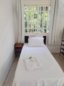 Postel nebo postele na pokoji v ubytování Refúgio dos pássaros