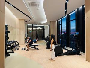 a group of people exercising in a gym at Axon Residence KL in Kuala Lumpur