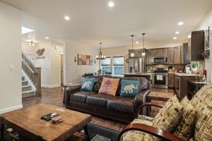 a living room with a couch and a table at Trails End Retreat in Bend
