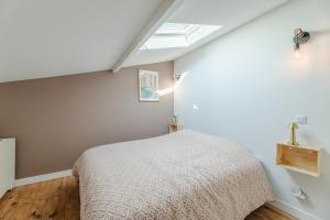 Ένα ή περισσότερα κρεβάτια σε δωμάτιο στο La loge premium - Bouscat au pied du tram