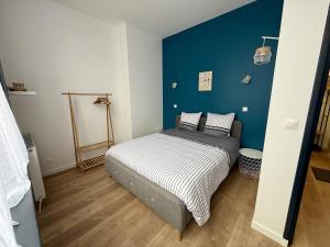Ένα ή περισσότερα κρεβάτια σε δωμάτιο στο Le Calais Wilson 1, 4 pers