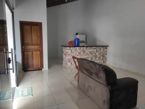 a living room with a couch and a fireplace at Residência Europa in Cacoal