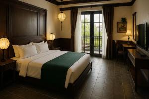 a hotel room with a bed and a television at Girtingak Verty in Travnik