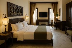 a hotel room with a large bed and a desk at Girtingak Verty in Travnik