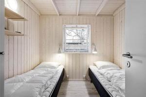 Postel nebo postele na pokoji v ubytování Modern beach summerhouse