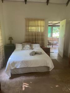 a bedroom with a large bed in a room at Proudly Okavango self-catering Burnside in Shakawe
