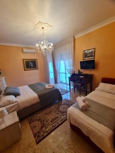 Ένα ή περισσότερα κρεβάτια σε δωμάτιο στο B&K Hotels