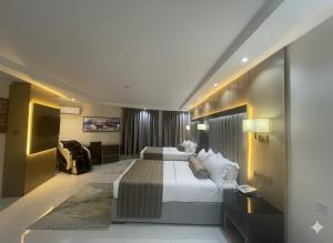 Ένα ή περισσότερα κρεβάτια σε δωμάτιο στο Villa Park Hotel Abuja