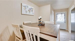 a dining room with a wooden table and chairs at Modern 2BR Stay with Large Parking Pet Friendly in Killeen +23 photos