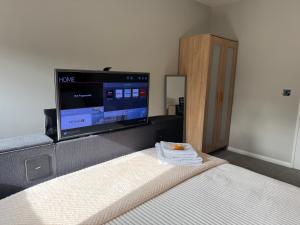 Μια τηλεόραση ή/και κέντρο ψυχαγωγίας στο Cosy and quiet apartment