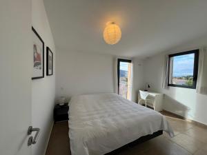 Postel nebo postele na pokoji v ubytování Les Trois Oliviers + 10 fotografií