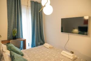 TV a/nebo společenská místnost v ubytování BARI CITY HUB _ Locazione Turistica