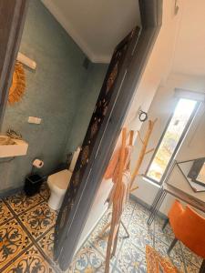 a bathroom with a toilet and a window at Ecolodge Dar bouhouta in Tahannout +56 photos