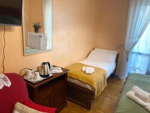 Ένα ή περισσότερα κρεβάτια σε δωμάτιο στο B&K Hotels