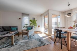 a living room with a couch and a table at BioTop Appartement Kronplatz in Perca