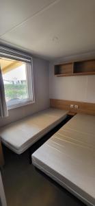 Postel nebo postele na pokoji v ubytování Mobil home 8 personnes