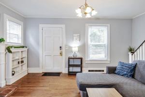 a living room with a couch and a table at The Woodside Guest House in Fayetteville