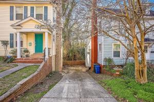 a house with a driveway in front of it at The Woodside Guest House in Fayetteville