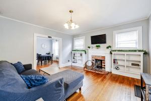 a living room with a couch and a fireplace at The Woodside Guest House in Fayetteville