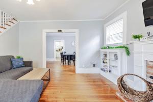 a living room with a couch and a table at The Woodside Guest House in Fayetteville