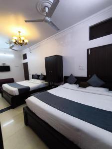 Postel nebo postele na pokoji v ubytování hotel blue star