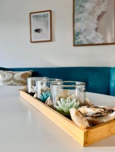 a tray with seashells and other items on a table at Opa Meyer in Glücksburg