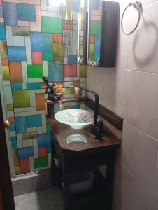 a bathroom with a sink and a mirror at Cabañas La Polaca 1 in Santa Clara del Mar +21 photos