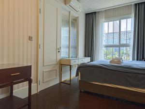 Cama o camas de una habitación en Grand Florida芭提雅带免费游泳池温泉桑拿浴和健身房瑜伽室私家海滩公寓E206 61 fotos más