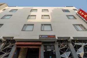 a building with a hotel sign in front of it at OPO Horizon Stanley Aerocity,Free Airport pick up or Drop in New Delhi