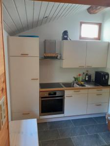 Η κουζίνα ή μικρή κουζίνα στο Hüsi