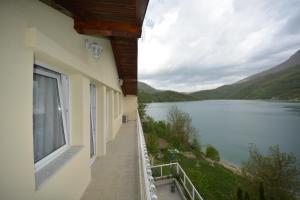 a balcony with a view of a lake at Villa Jablanica Lake in Jablanica