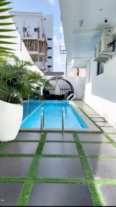 a swimming pool on the side of a building at White Stone in Lekki