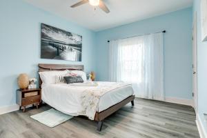 a bedroom with a bed and a ceiling fan at Prime Beachfront Large Deck Family Fun in Port Bolivar