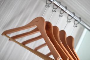 a wooden chair hanging from a metal hook at Venus Boutique Hotel in Malacca