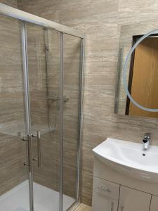 a bathroom with a shower and a sink at Allen's property in Birmingham