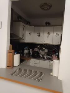 a kitchen with white cabinets and a counter top at Apartamento Residencial mojacar in Mojácar