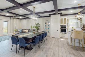 a kitchen and dining room with a table and chairs at Casa Sol Y Mar in Port Isabel