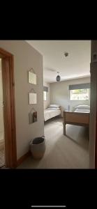 Ένα ή περισσότερα κρεβάτια σε δωμάτιο στο The Stables