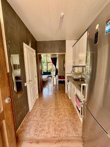 a kitchen with a refrigerator and a counter top at AlquilerSalou Loft B in Salou +11 photos