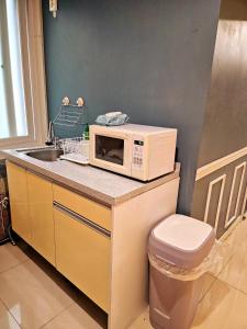 a microwave oven sitting on a counter in a kitchen at 가가하우스 을지로 in Seoul