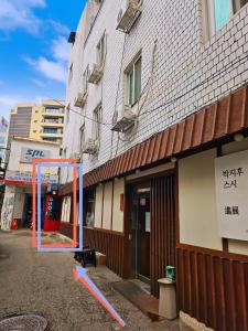 a building with a basketball hoop in front of it at 가가하우스 을지로 in Seoul +22 photos
