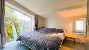 Postel nebo postele na pokoji v ubytování Spacieuse villa dans le centre du village à proximité de la mer et du port