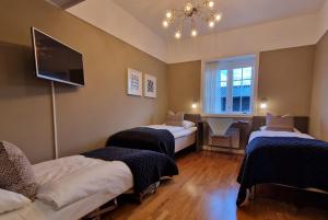 Postel nebo postele na pokoji v ubytování Hotell Jeløy Radio