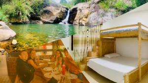 a room with a waterfall mural on the wall at e34 Café, Restaurant & Hotel Koslanda Hideaway with a Private Natural Pool in Koslanda +76 photos