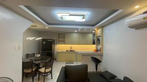 a living room with a kitchen and a dining room at Silang Guest house in Bangkal